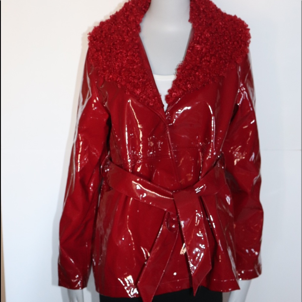 Woman red vinyl jacket with attached collar.